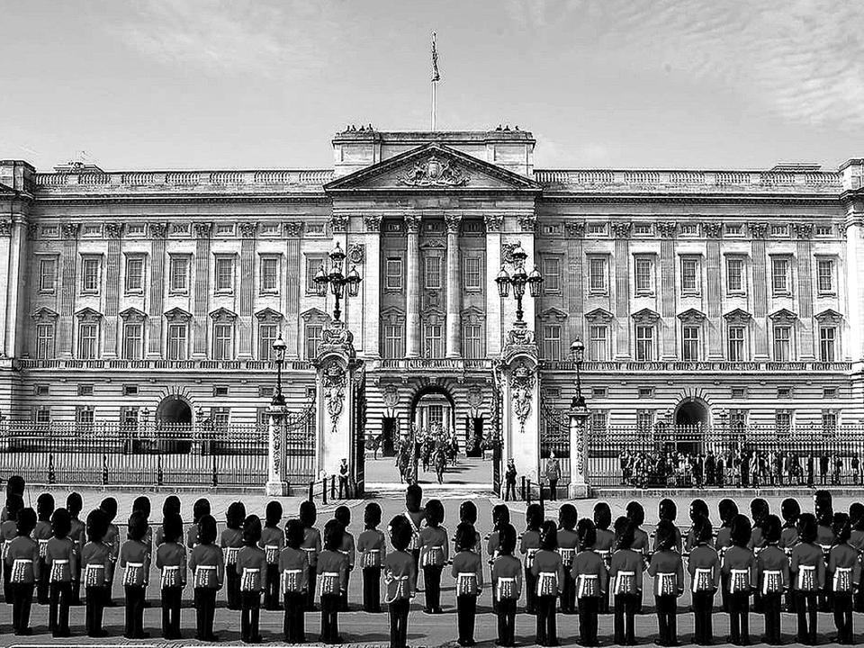 Buckingham Palace in London with the King’s Guard in formation